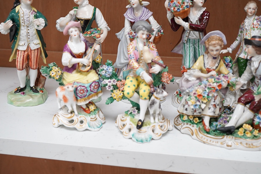 Four pairs of porcelain figures, a single figure and seated figure group, all after Chelsea and Derby originals, together with a Meissen style schneeballen porcelain sucrier and cover, (12)